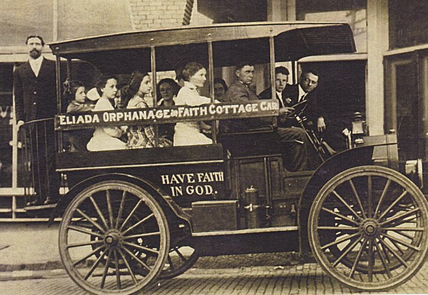“The Gospel Wagon” Rev. Compton, standing in back, heads into Asheville (Photo ca. 1911). 