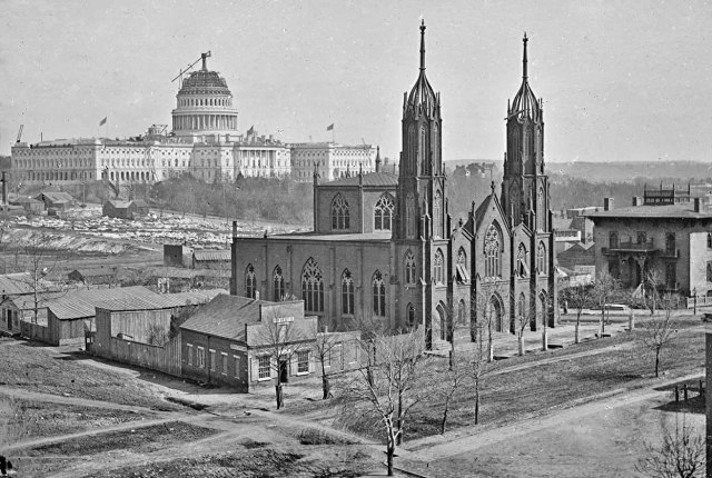 Trinity Church with the U. S. Capital Building Dome under construction during the Civil War.