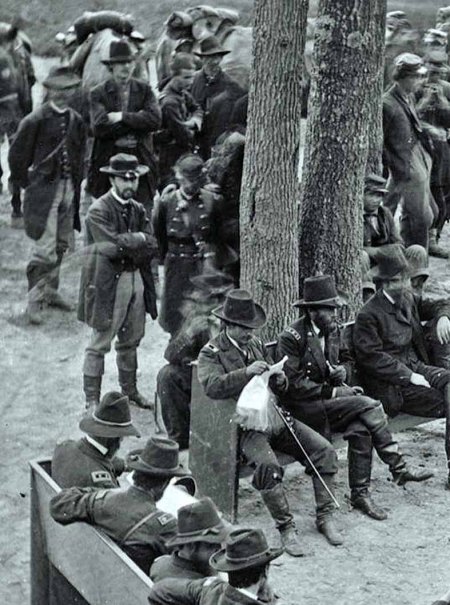 The Overland Campaign–General Grant examining a map held by General George G. Meade at Massaponax Church, Virginia on May 21, 1864