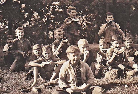 Curly (standing in the back) enjoying a watermelon break with his orphanage brothers