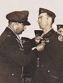 Capt. Crysler receiving a medal