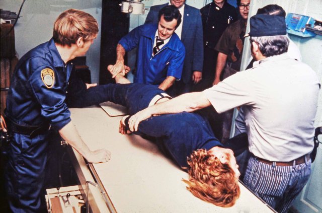 Paul John Knowles receiving treatment from Dr. J.A. Bissitt directly after being captured and before being taken to Henry County jail